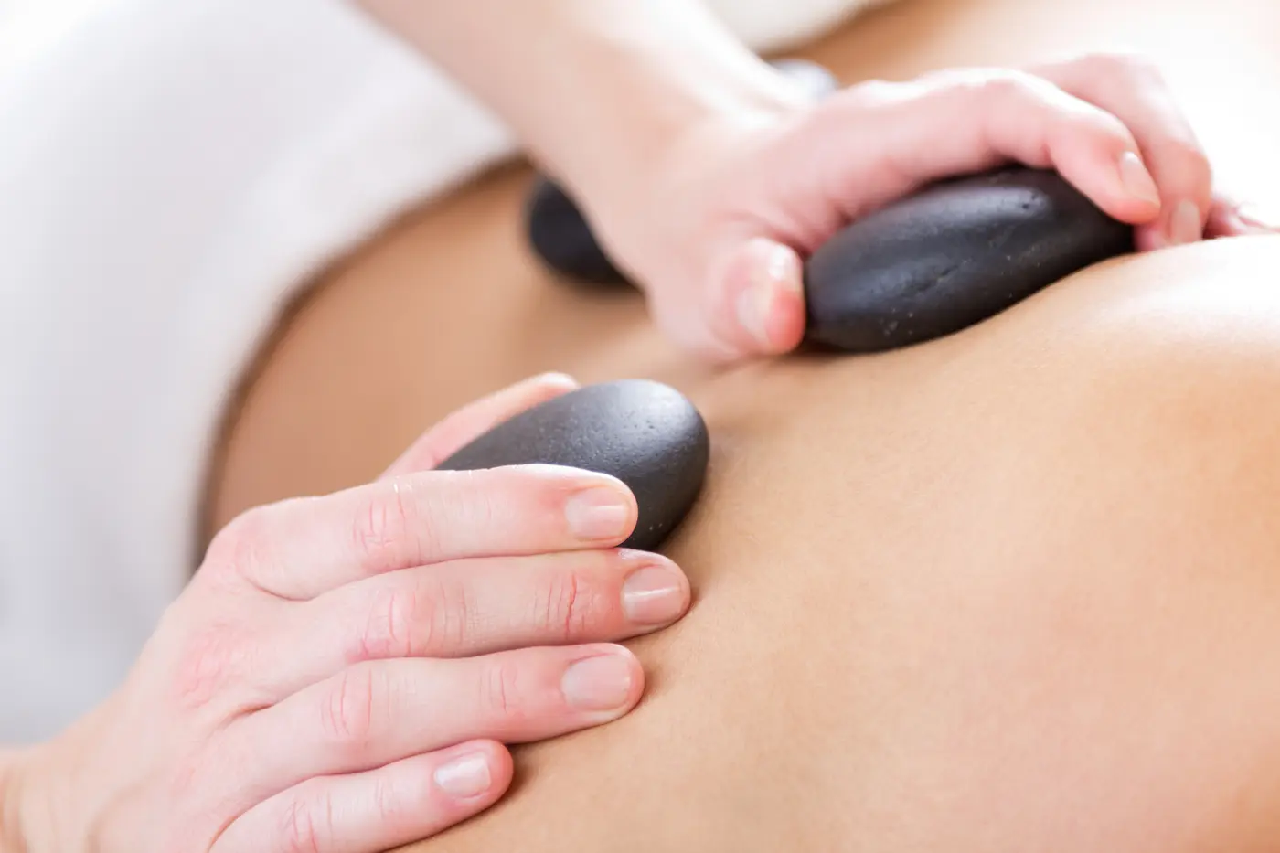 Equipment and setup for a whole body hot stone massage.